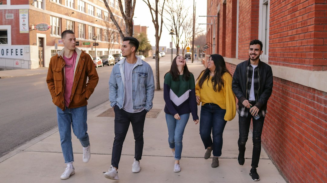 Young people from diverse backgrounds walking together, representing global youth cooperation
